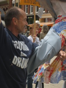 Michael Walli and the other two members of the Transform Now Plowshares joined with supporters for street theater in downtown Knoxville before walking to court for the beginning of their trial.  May 6, 2013.  Photo by Felice Cohen-Joppa