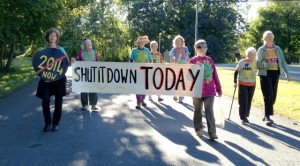 Shut It Downers advance to the Vermont Yankee gate: from left - Ulrike Von Moltke, Paki Wieland, Nancy First, Hattie Nestel, Linda Pon Owens, Ellen Graves, Anneke Corbett and Frances Crowe.  Photo by Marcia Gagliardi