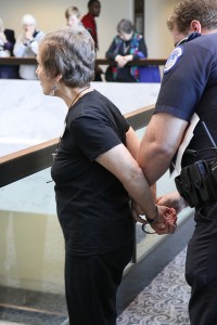 One of four drone protesters being arrested.  Photo by Ted Majdosz