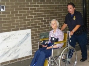 Sue Clark being arrested at the Albany Federal Building.  Photo by Marcia Hopple