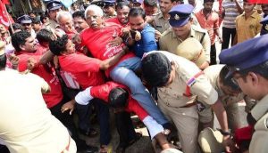 CPI(M) leader Ch. Narasinga Rao being taken into custody at Kosta junction in Srikakulam district on Sunday.— Photo: Basheer